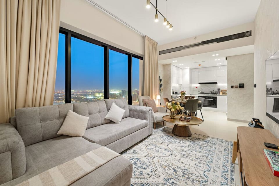 Living Room: Stylish lounge with stunning skyline views, modern decor, and chic dining space!