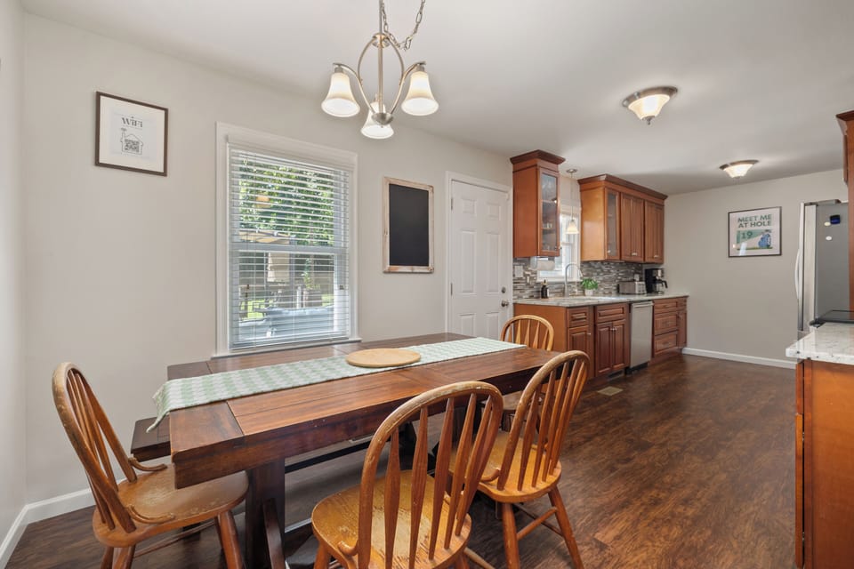 Sunlit and spacious, the dining area features a sturdy table,comfortable seating