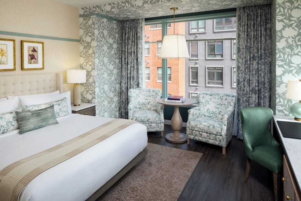 Suite with a king bedroom and fireplace.