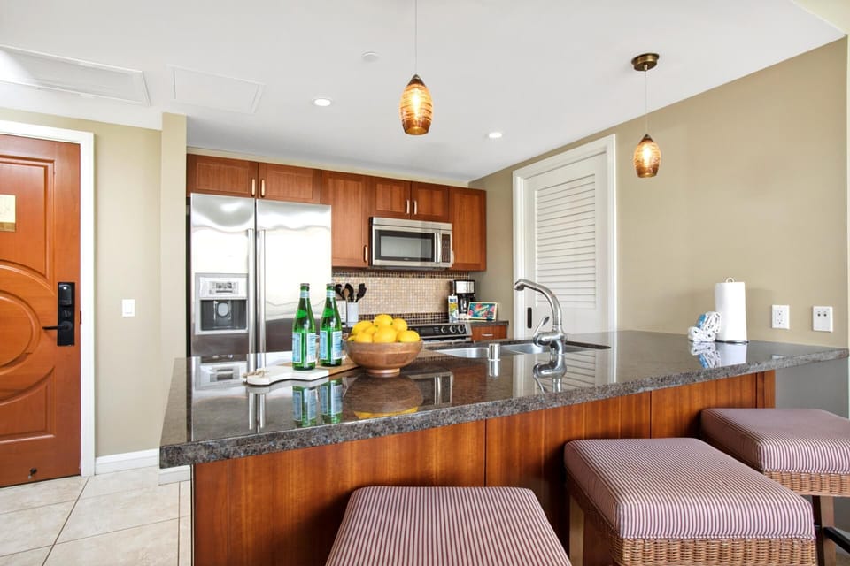 Modern kitchen featuring stainless appliances and ample prep space HKH-516