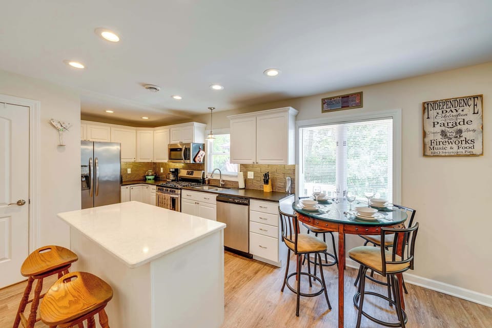 The breezy, open kitchen offers ample space & every home comfort​