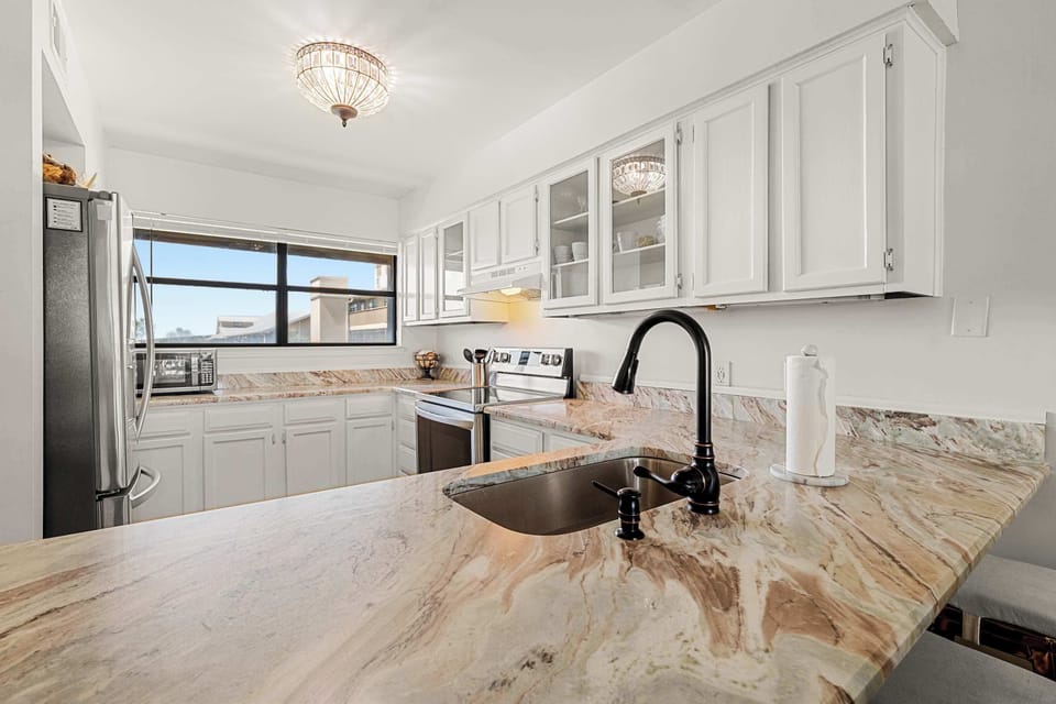 Granite kitchen countertop and a view towards the Ole River