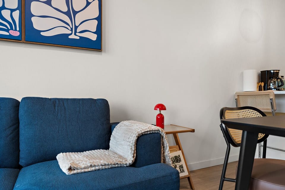 Vibrant decor paired with a stylish sofa invites relaxation and fun chats!