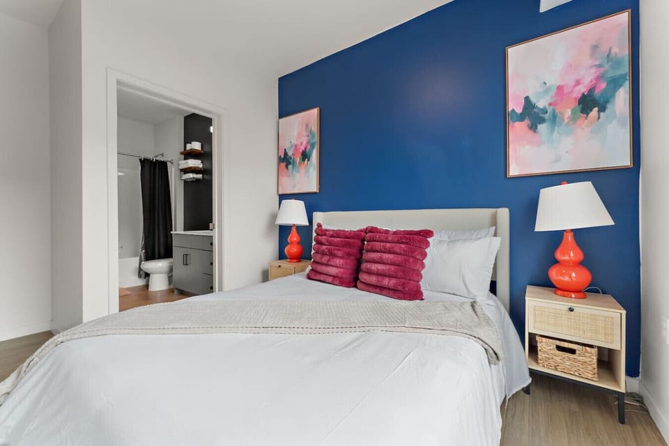 Bedroom: Vibrant retreat with striking blue walls, plush pillows, and stylish decor for relaxation.