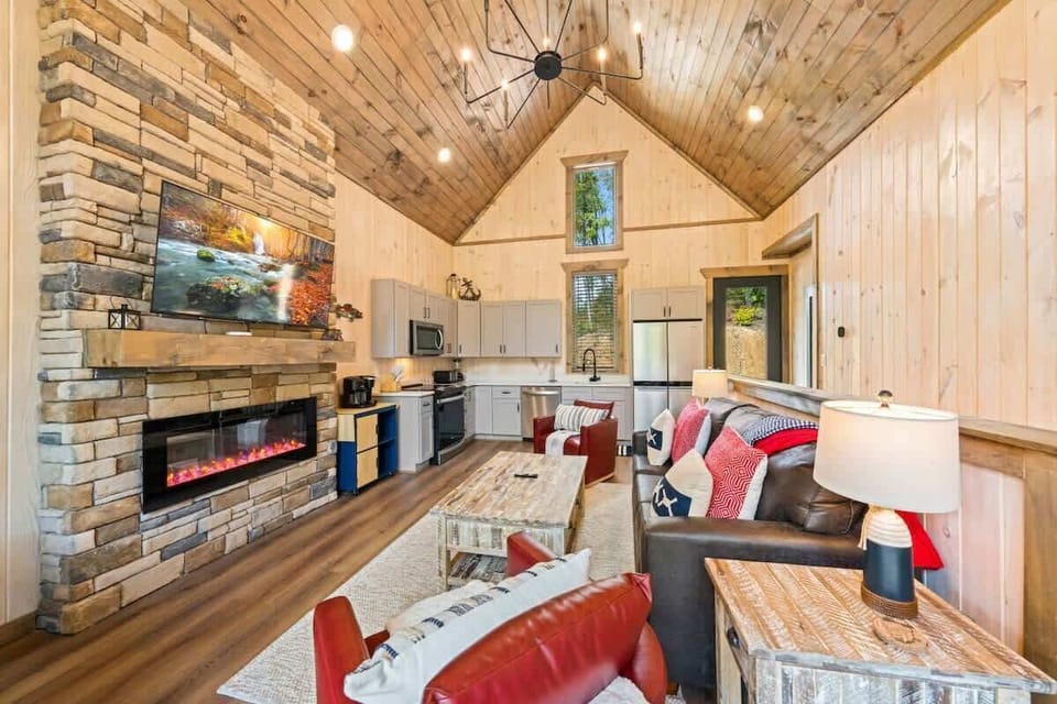 Open living area with smart TV and an electric fireplace.