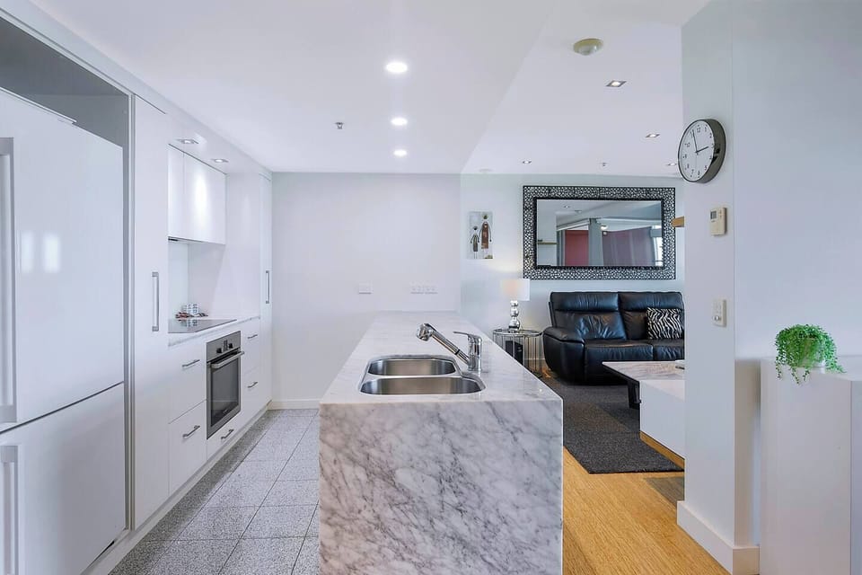 Whip up a delicious meal in the modern kitchen, fully equipped with stainless steel appliances and all your cooking essentials.
