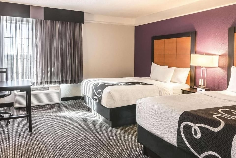 Wake up to natural light in a spacious double-queen layout.