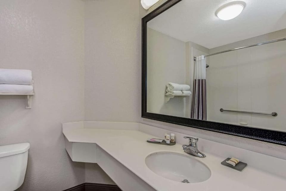 Refresh effortlessly at the bright vanity with extra counter space.