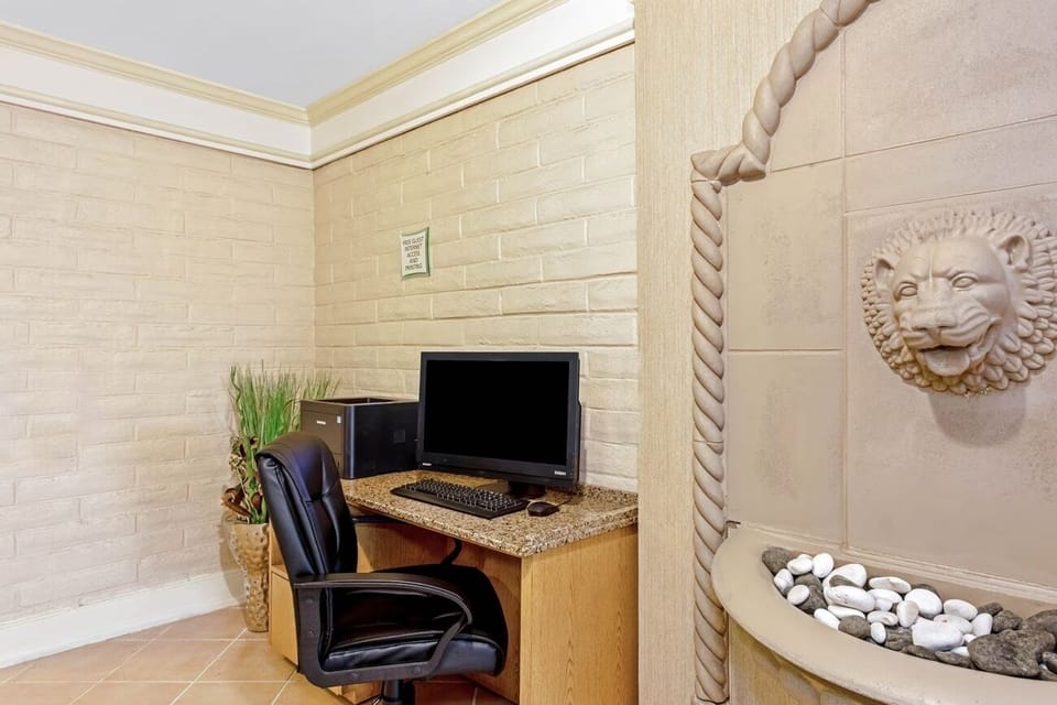 Relax in the cozy lounge with TV and comfy seating.