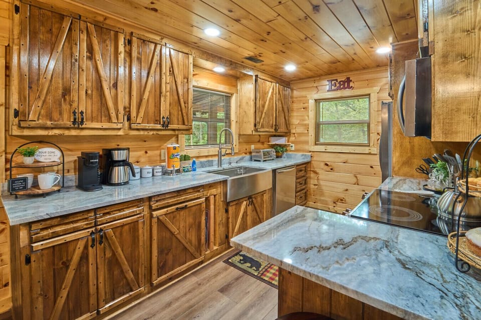 Rustic Cabin Kitchen | Wood Cabinets, Stone Countertops & Stainless Steel Appliances