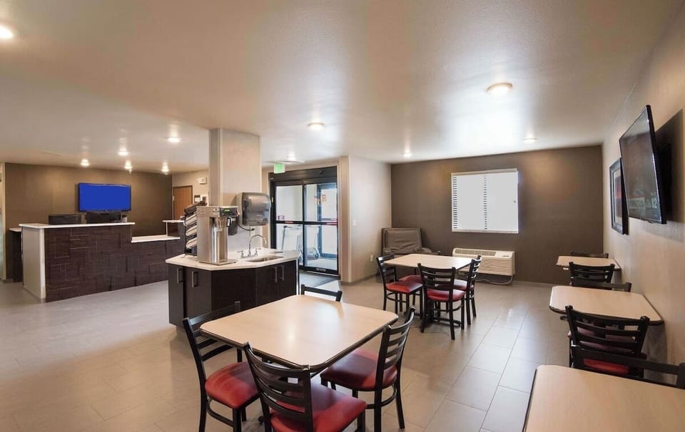 Gather comfortably for breakfast with spacious tables and bright lighting.
