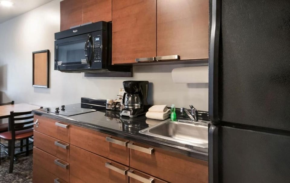 Whip up quick meals with microwave, sink, and full fridge.