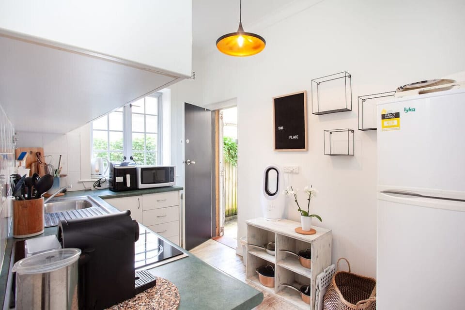 Kitchen Haven: Bright and airy space filled with modern appliances and charming decor!