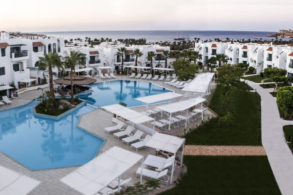 Soak in sweeping pool views with the sea beyond.