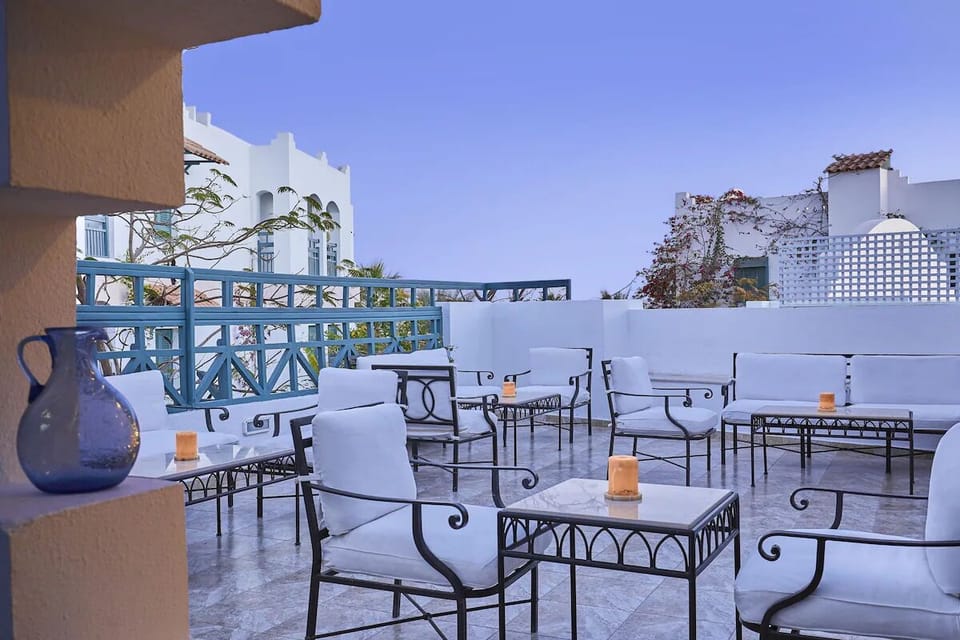 Unwind at sunset on the breezy terrace with candlelit loungers.