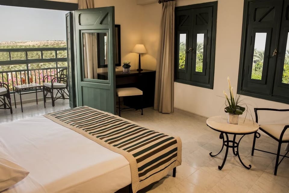 Wake up to balcony breezes and lush garden views.