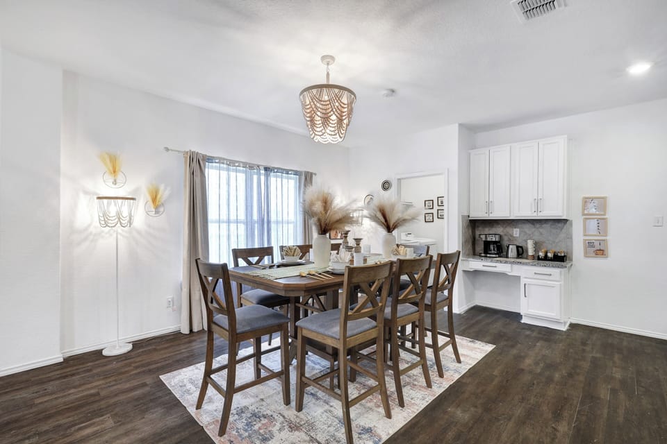 Spacious dining table that sits 8 with full tableware and silverware included.