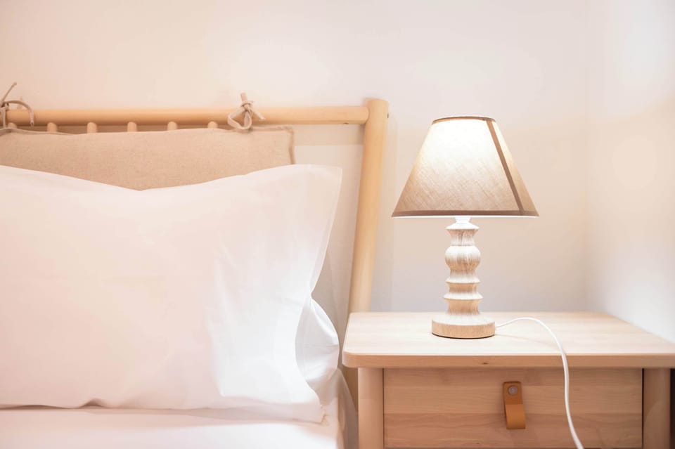 Bedside table with soft lighting and minimal decor