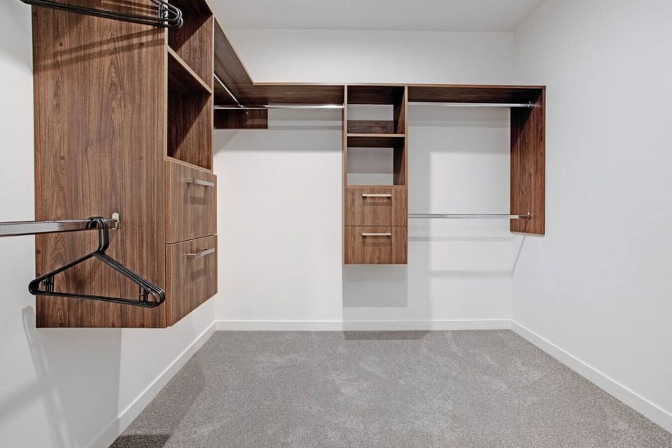 The walk-in wardrobe has plenty of storage space for all your personal belongings.
