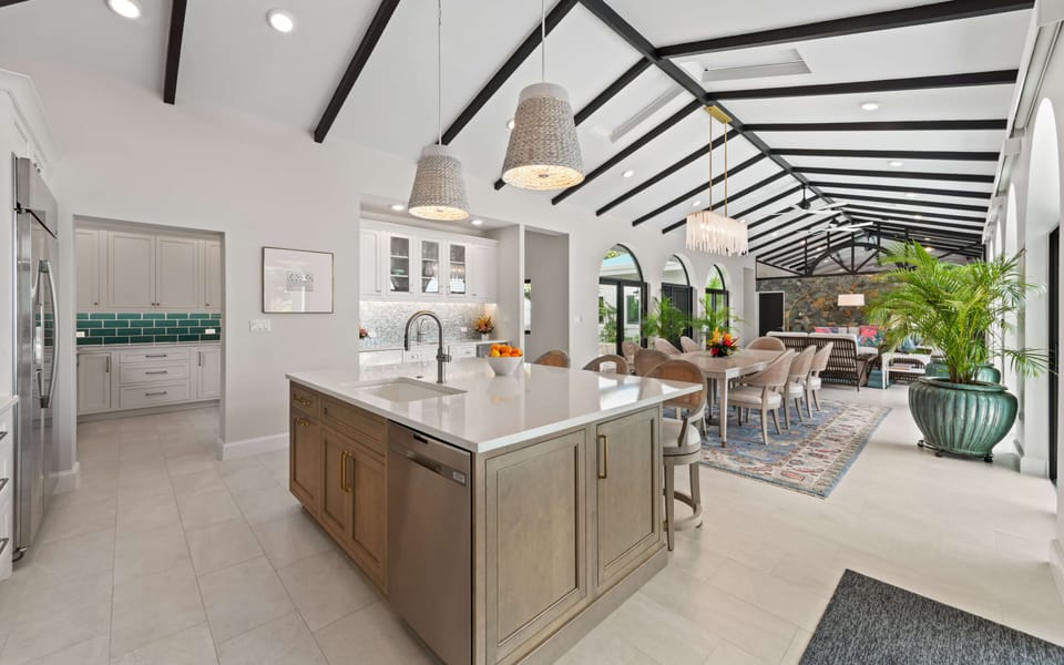 Seamless indoor living space connecting kitchen, dining, and seating areas for e