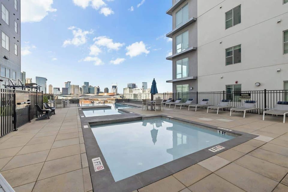 - Lounge by the rooftop pool with open city views and sunny skies  
- Plenty of seating makes it perfect for relaxing or tanning  
- Refresh after exploring downtown hotspots and local dining  