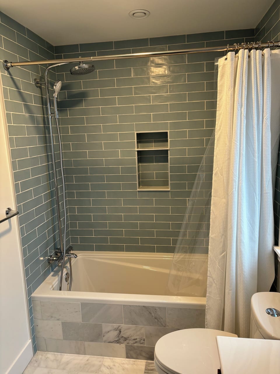Upstairs bathroom with tub, shower and heated floors