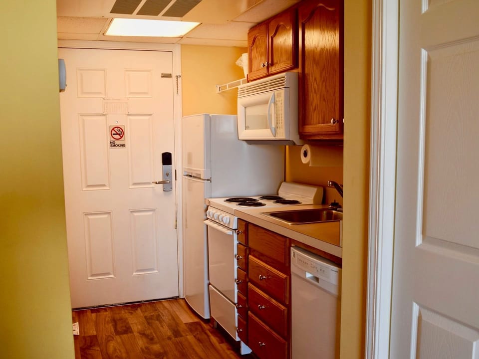 Compact kitchen with essentials for preparing home-style meals.