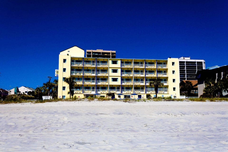 Beachfront exterior of Jade Tree Cove with direct sand access.