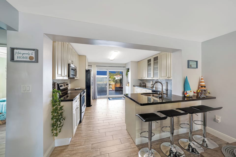 Indoor bar-style workspace with water views and A/C stay cool,  and inspired.