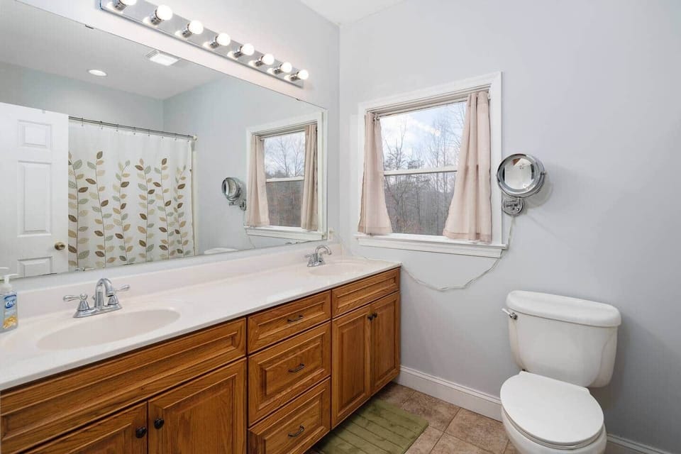 Double sink bathroom in master suite.