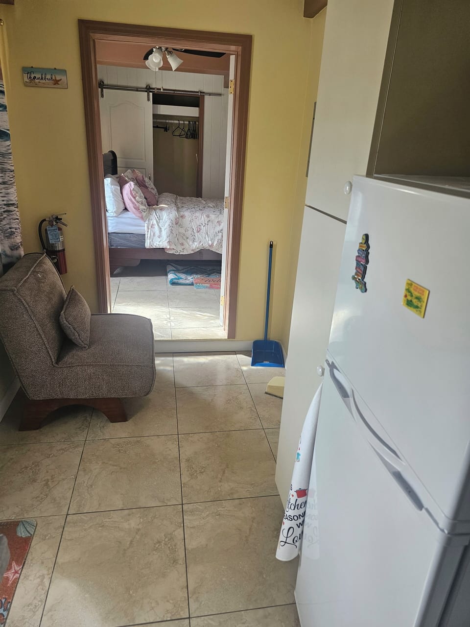Inside the Airbnb. View from the kitchen to the library area and bedroom.