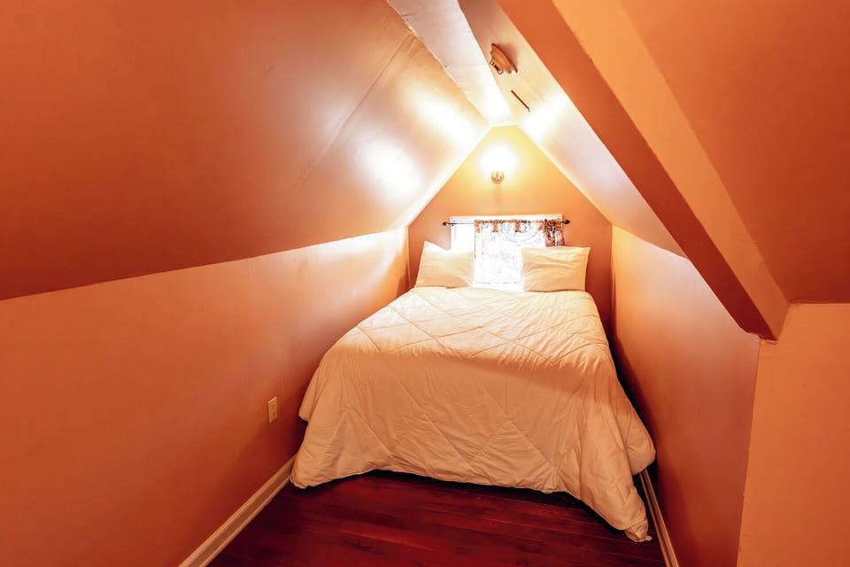 Snuggle into a charming loft nook with intimate, cozy vibes.