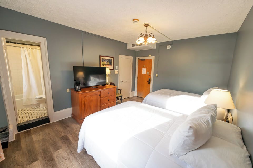 Recharge after adventures in a roomy, light-filled bedroom.