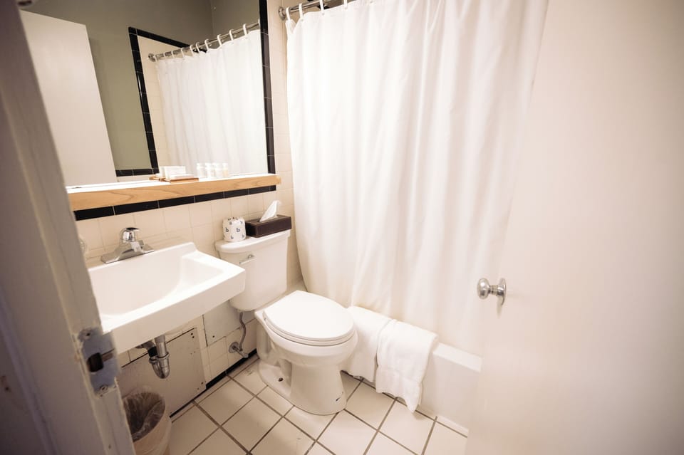 Rinse off in a bright, clean bath with simple comfort