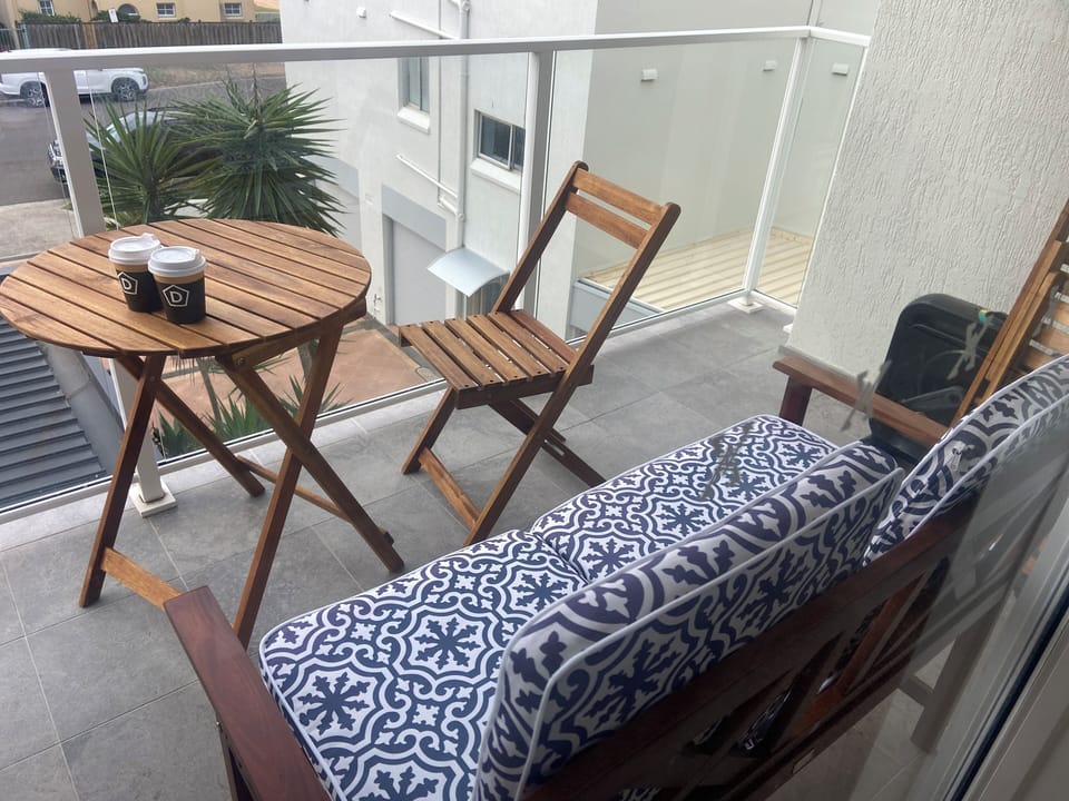 Balcony with view is sheltered from the windy ocean 