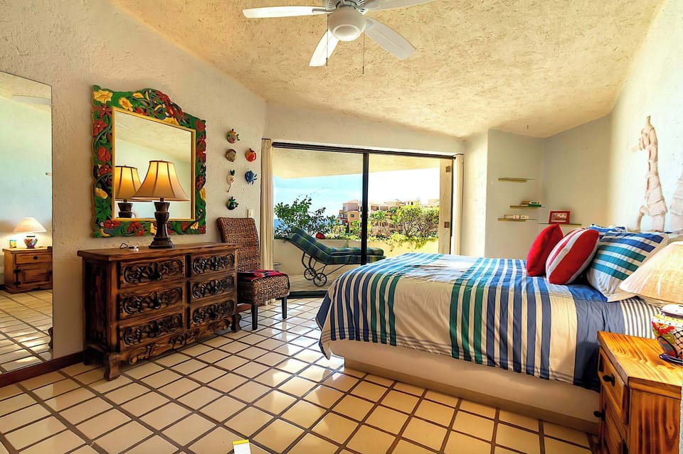 King-size bed in a bright, airy master bedroom.