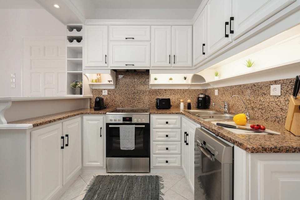 Kitchen fully equipped with a dishwasher, Nespresso and filtered coffee options, tea, kettle, microwave, toaster and drinkable filtered water.