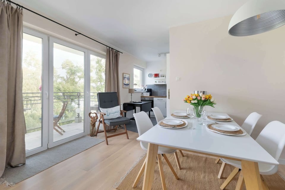 The dining area is harmoniously connected to the kitchen area.