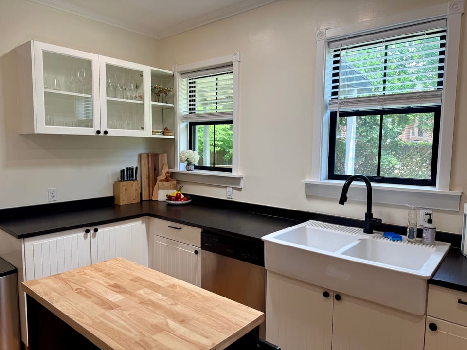 Fully stocked kitchen with GE appliances and adjacent walk-in pantry