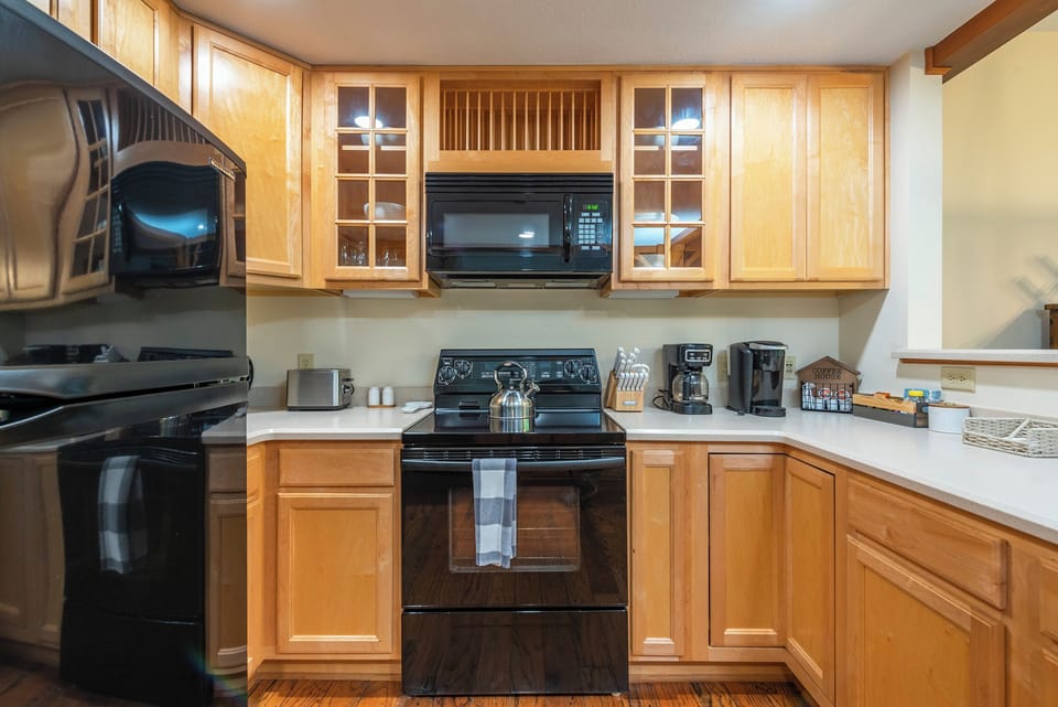 Warm wood cabinetry and modern appliances!