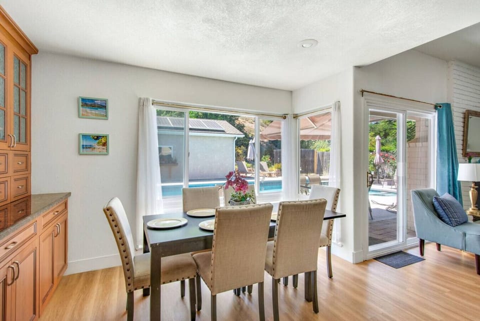 This dining space overlooks the backyard, offering a bright and relaxing setting for family meals.