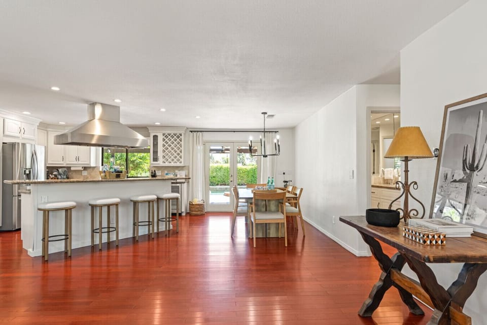 Open kitchen view w/ island seating, stainless appliances & a seamless flow into the living area.
