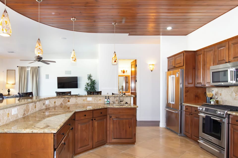 Kitchen with eat-in counter seating.