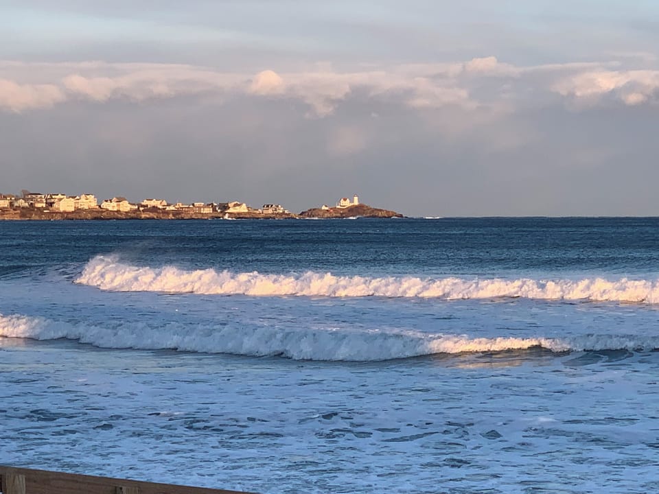 View of Nubble Lighthouse in front of Sea Spray Cottages.