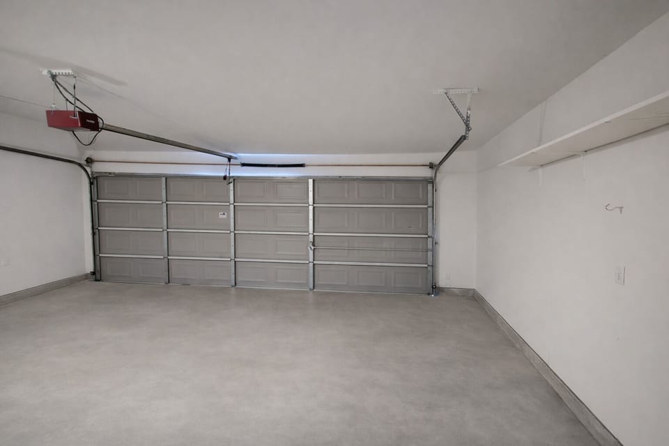 Spacious Garage Offering Storage and Parking for Work Vehicles and Crew Equipment
