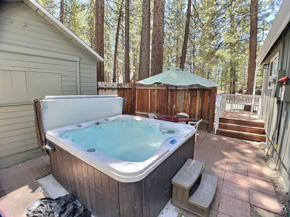 Soak in your private hot tub surrounded by towering pines, where bubbling jets and forest tranquility create the perfect mountain retreat.