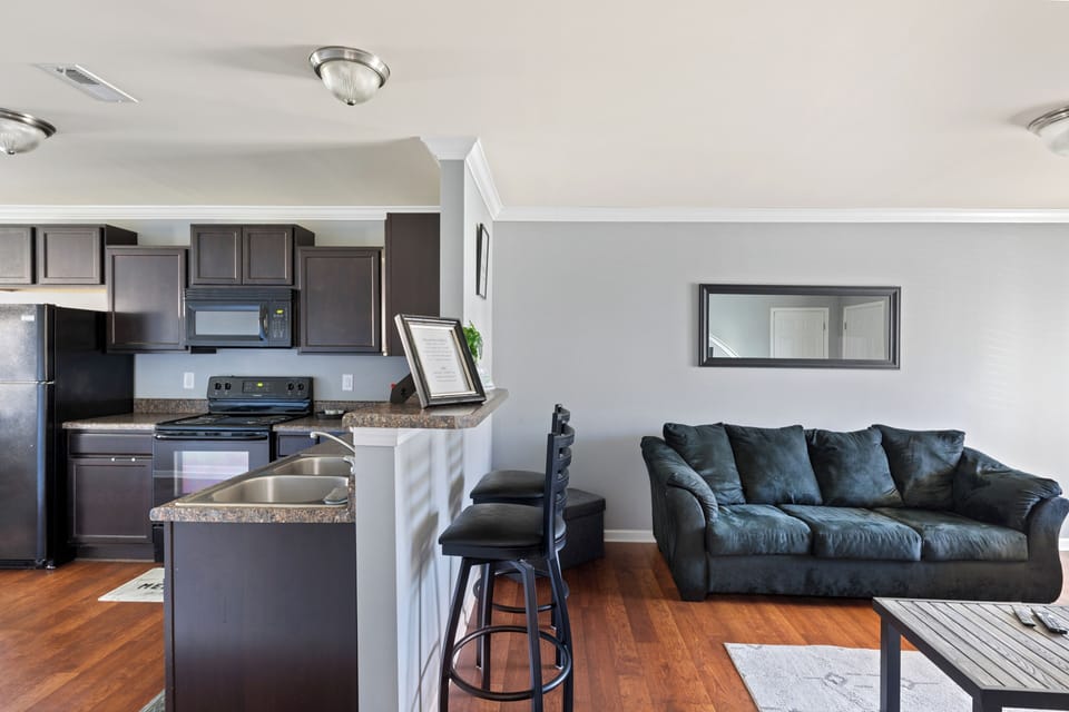 Living Room space with coffee table, pull-out sofa and TV for entertainment