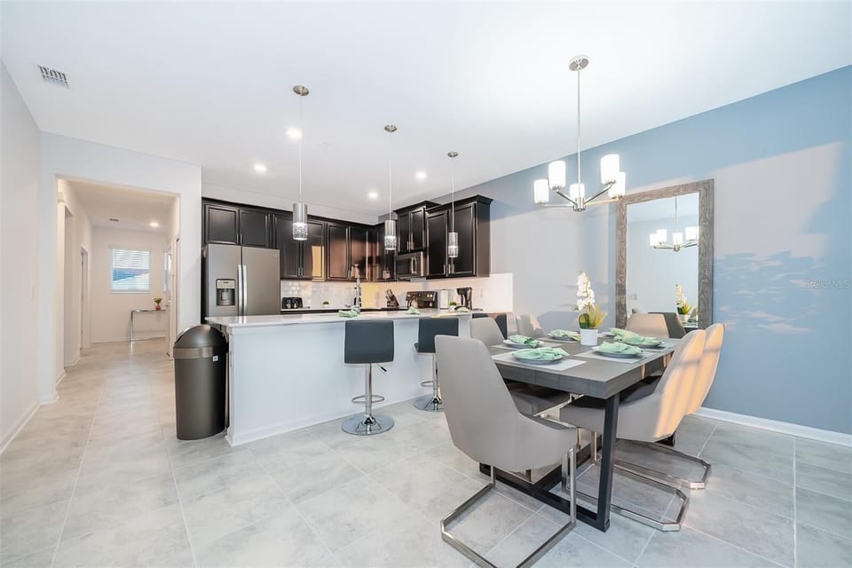 Bright and open dining space — the heart of your Champions Gate vacation home.