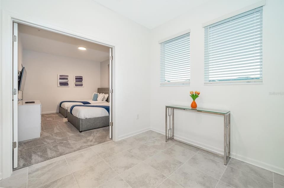 Family-friendly bedroom with cozy bedding — comfort and style combined in Champions Gate
