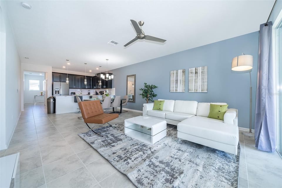 Cozy living room with large flat-screen TV — ideal for family movie nights near Disney